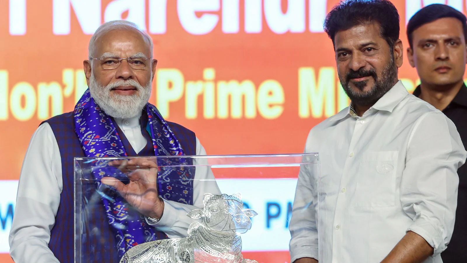PM Modi jokes with CM Revanth Reddy at Hyderabad occasion
